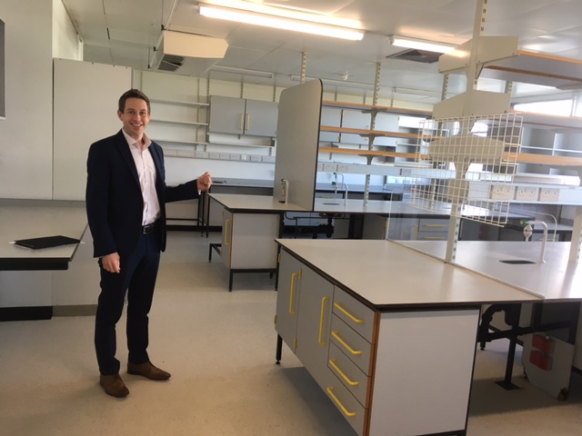 Doug Brown doing a thumbs up in the new, empty labs. 