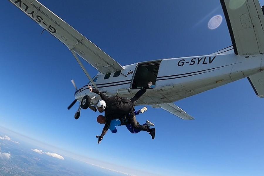 Man jumping out of a plane.