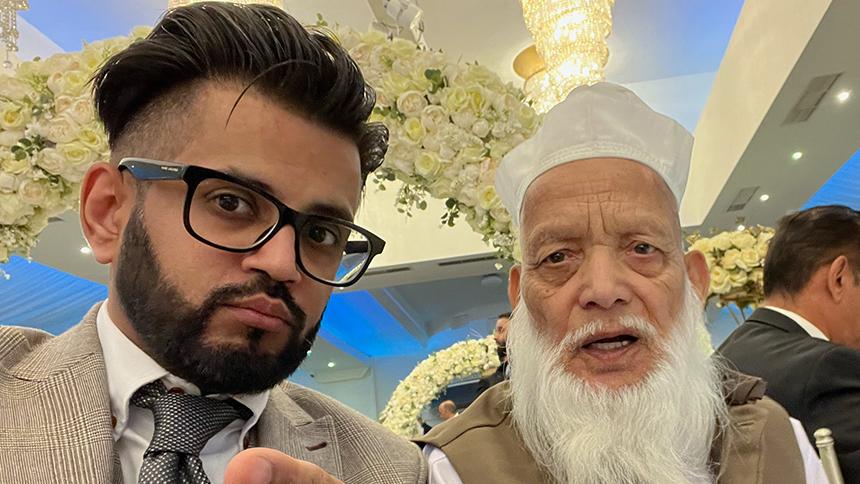 Shahbaz and his father Muhammad pose for a photo together