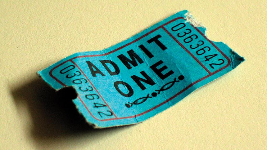 Small green cinema ticket with 'Admit One' on it