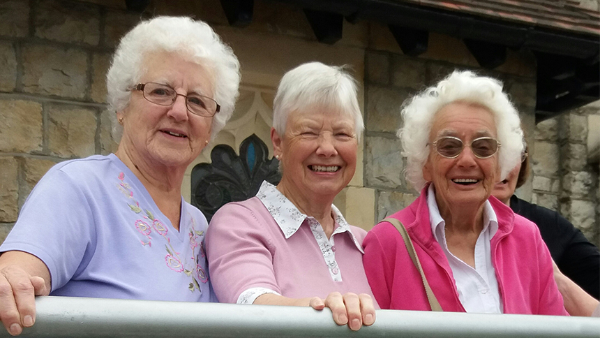 Three women standing next to eachother