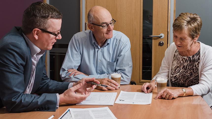 Two people consulting a solicitor