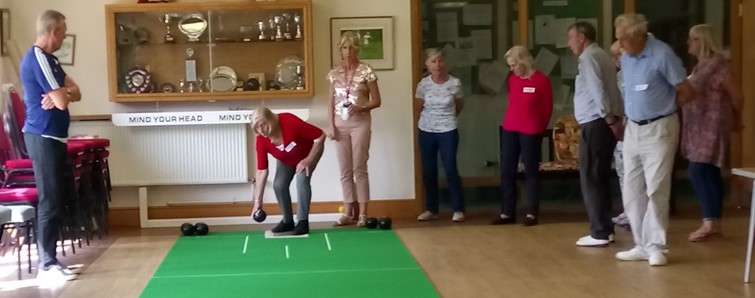 Image shows people at the bowling club they set up in Essex.