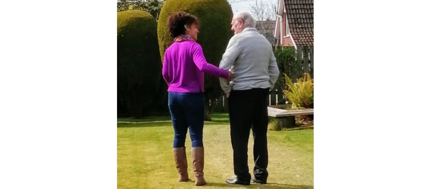 Janice walking in the garden with her father