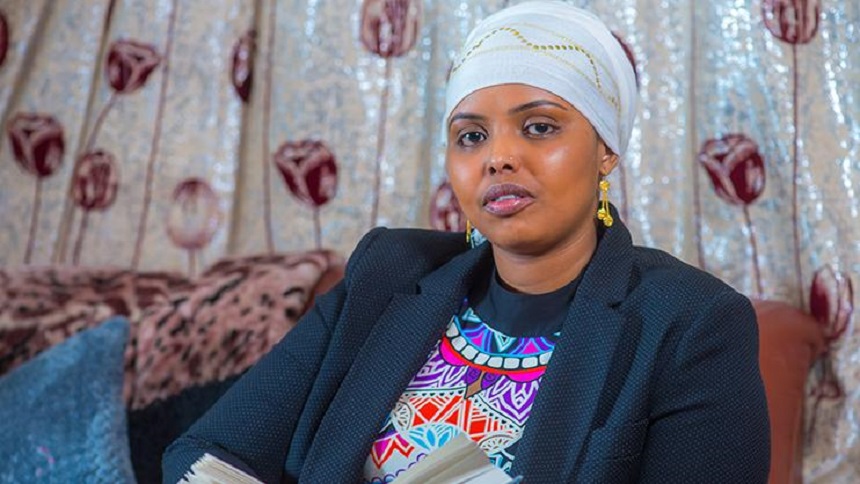 Khadra Abdi sitting on a sofa