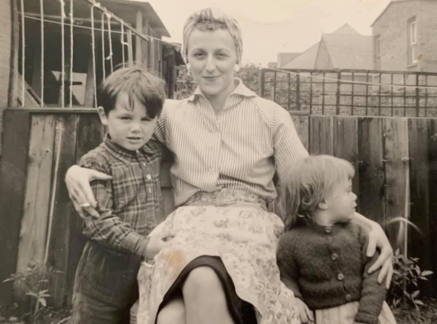 An old photo of Julie's mum, Eileen, in the garden with her children