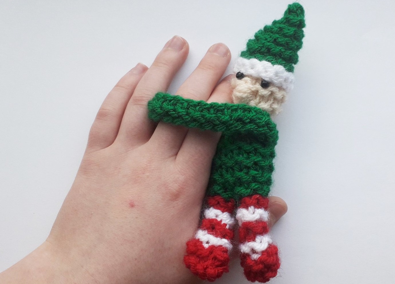 Snuggle Elf hugging fingers