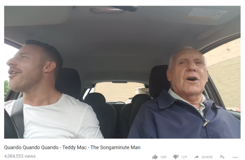 Teddy Mac singing in a car with his son