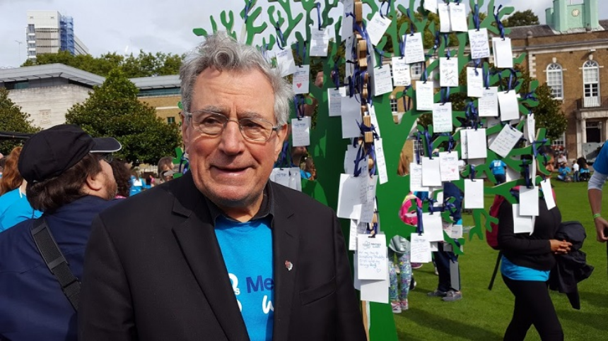 Terry Jones in front of wooden 'memory tree'