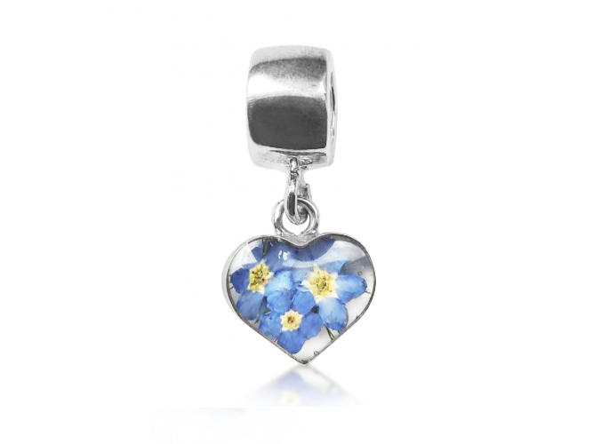 A silver heart charm with forget-me-not design