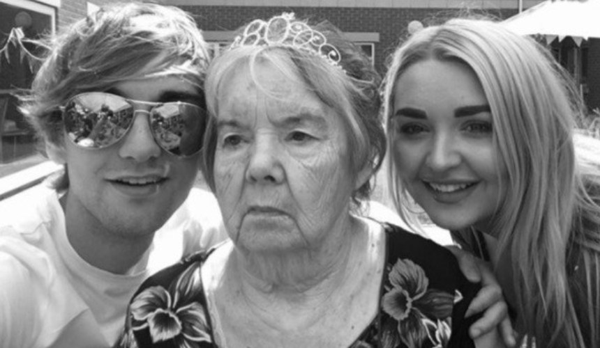 Nicholas with his sister and grandmother celebrating her 80th birthday