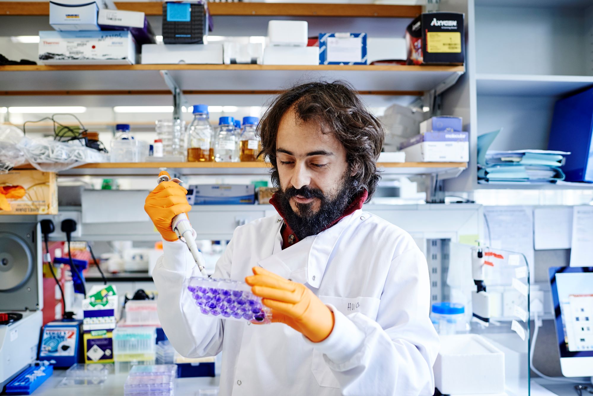 Man in scientist white jacket in a laboratory