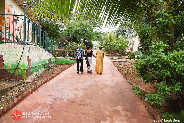 Women and dementia: Three women walking down a road in India 