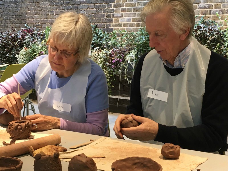 Lori and John creating pots.