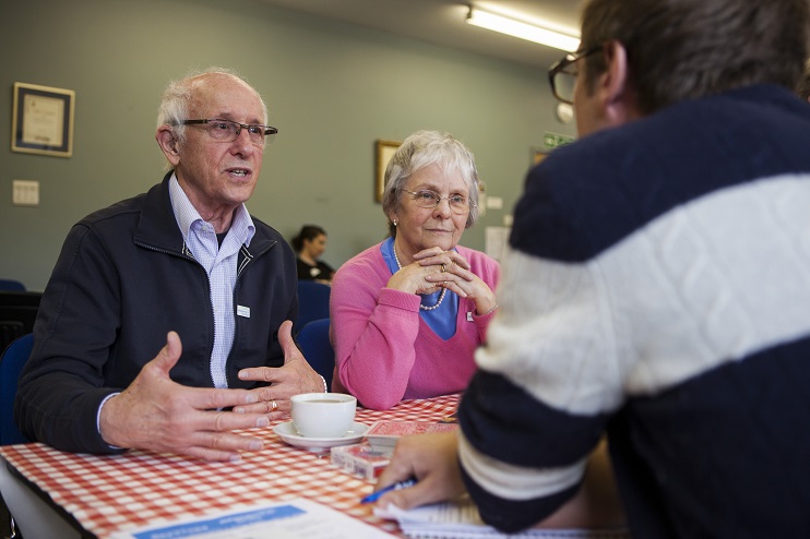 Dementia Support Officer speaking to two people