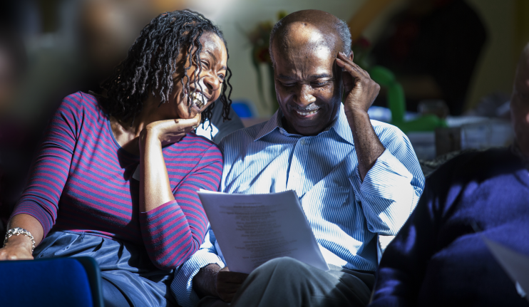 Man and a woman sat down and laughing