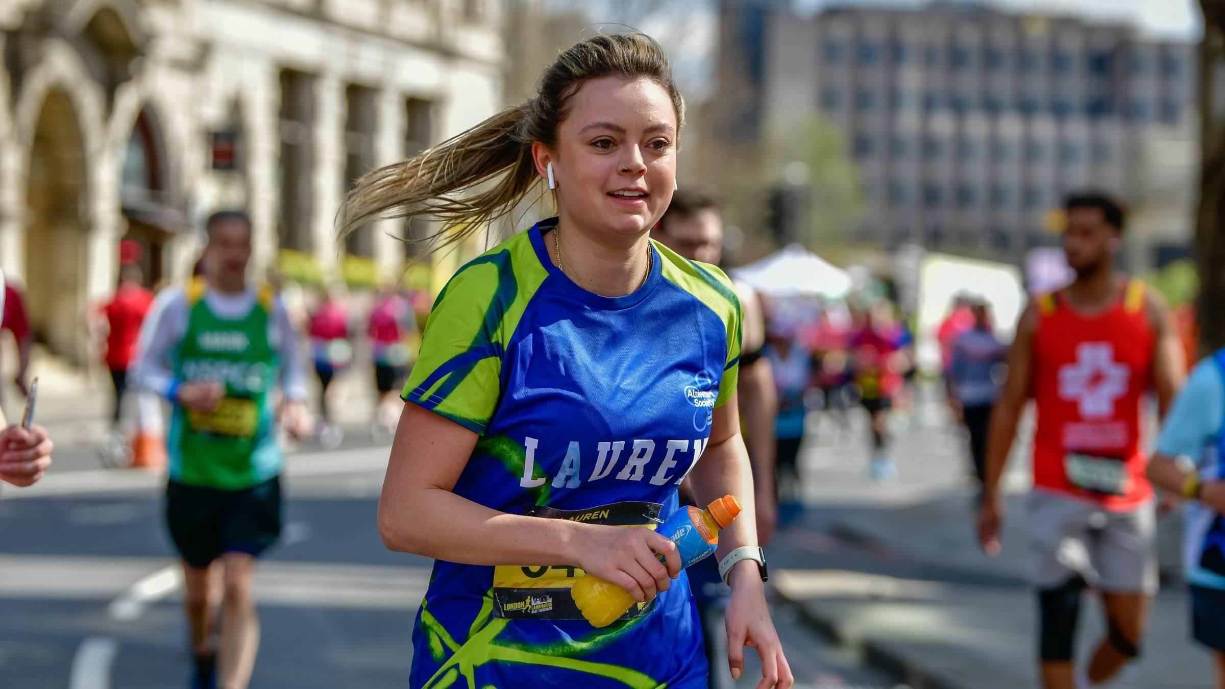 Woman running at London Landmarks Half Marathon 2022
