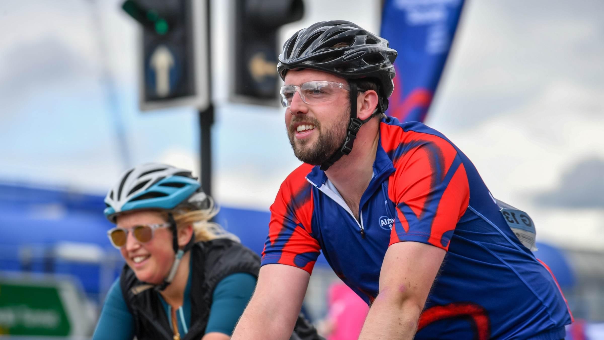 Man riding and smiling at Ride London 2022