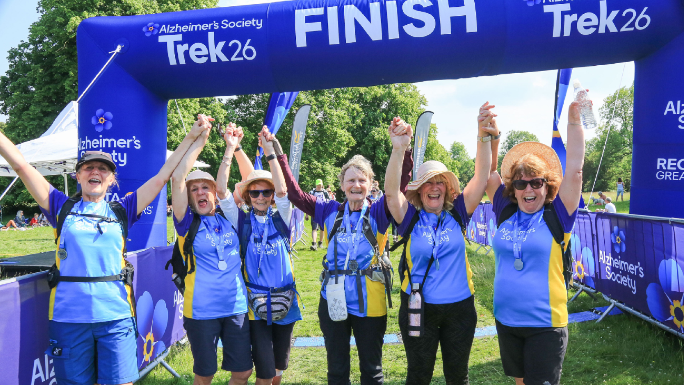 A group of trekkers  finish line