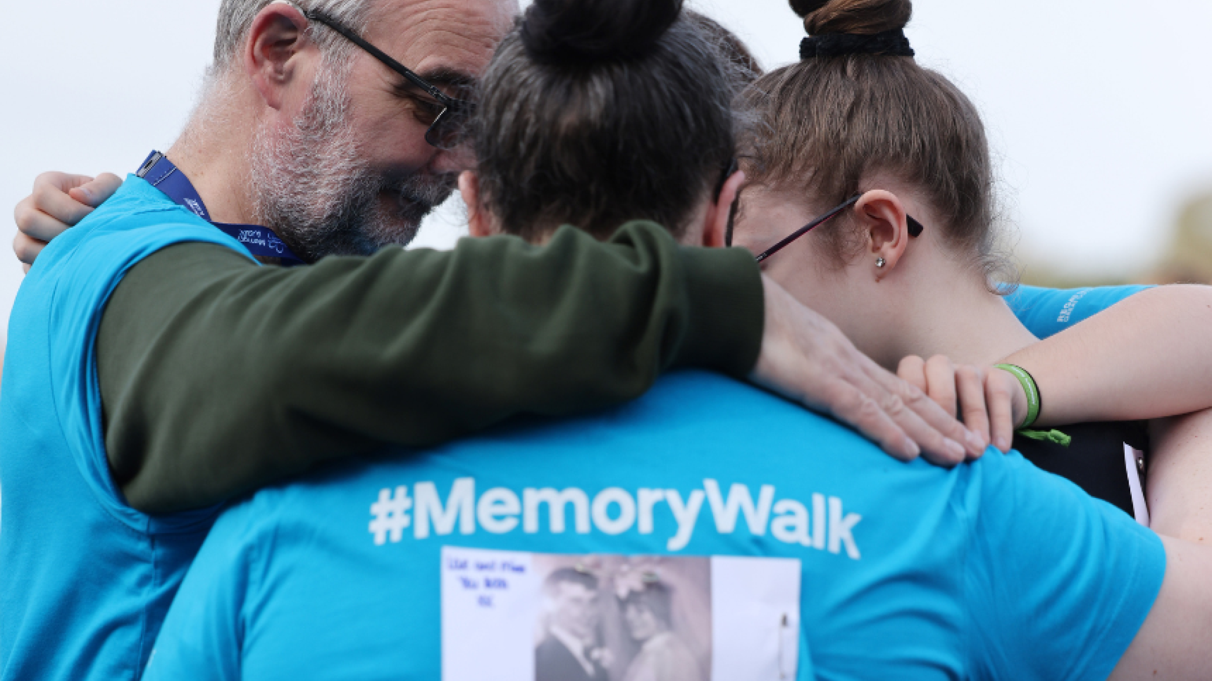 Memory Walkers embracing at Heaton Park