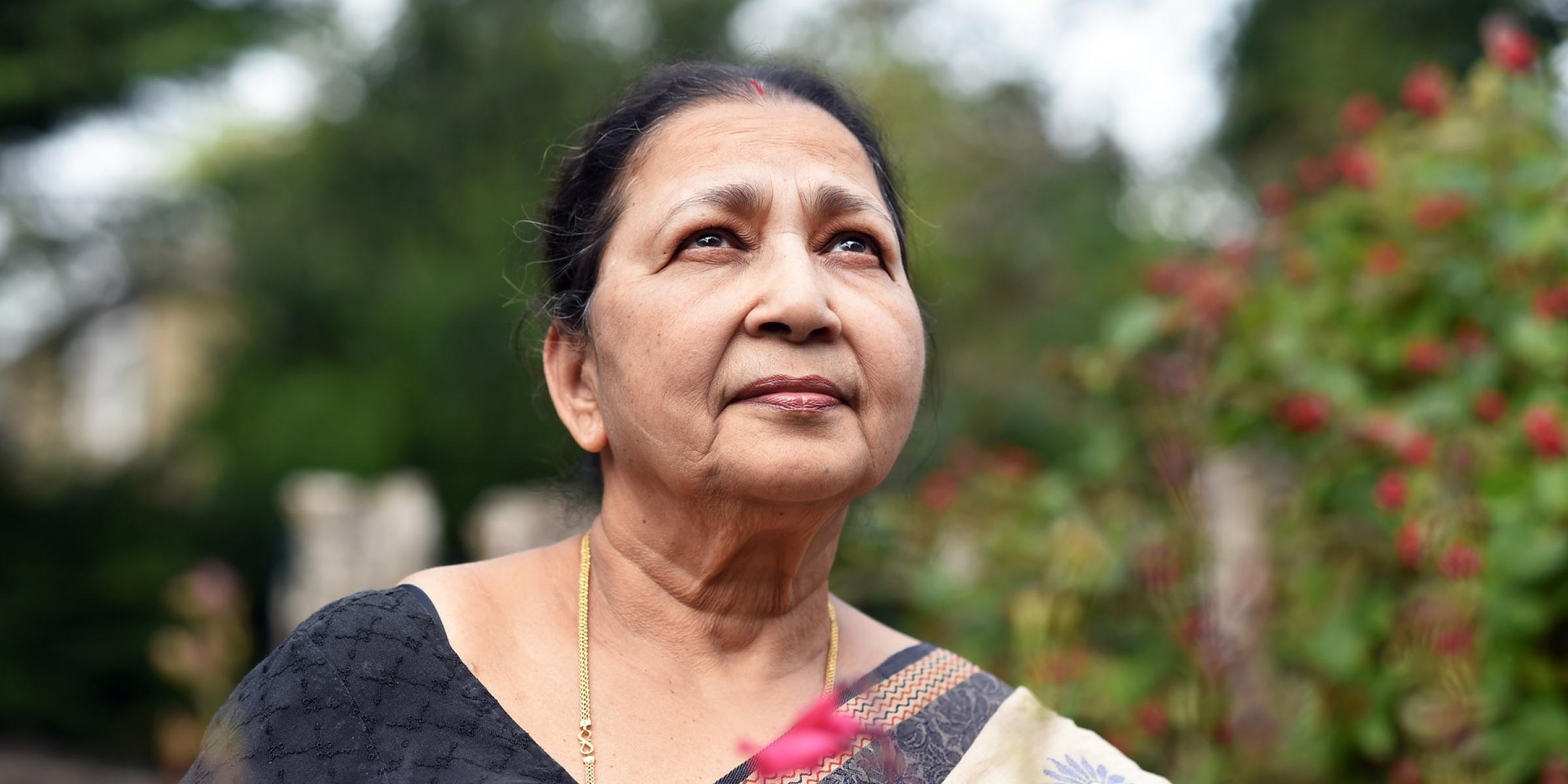 Anima Bhuiya smiling in her garden