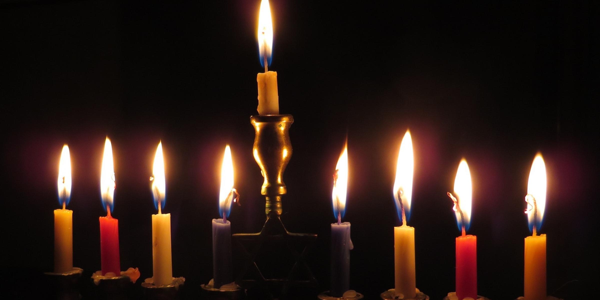 Nine lit menorah candles for a dementia-friendly Hanukkah