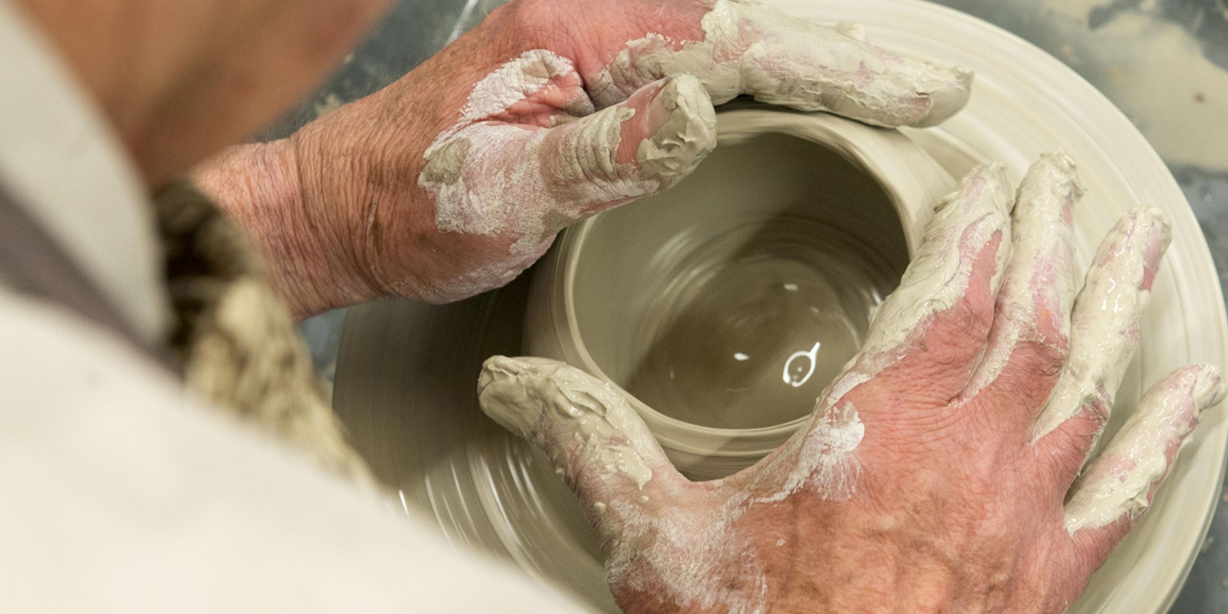 A person doing pottery at the Wabi Sabi Pottery Group