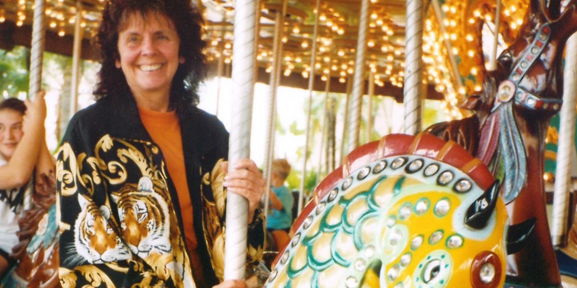 Julie riding a carousel