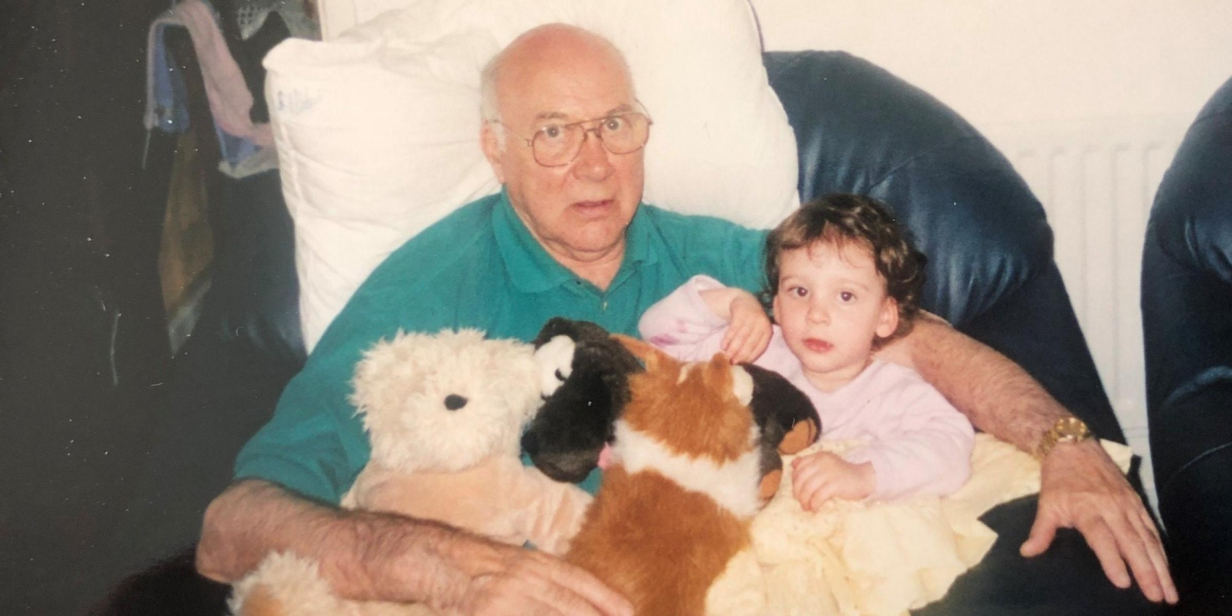 Olivia Fairhurst as a child sitting in the lap of her grandfather, Robert