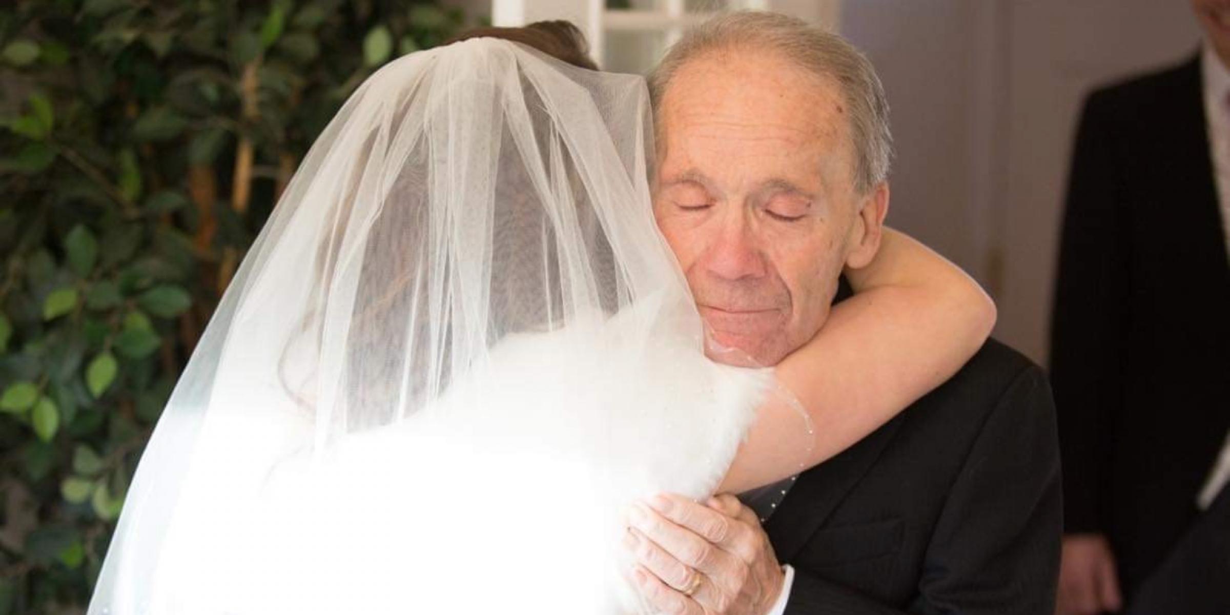Natasha's granddad hugging her on her wedding day