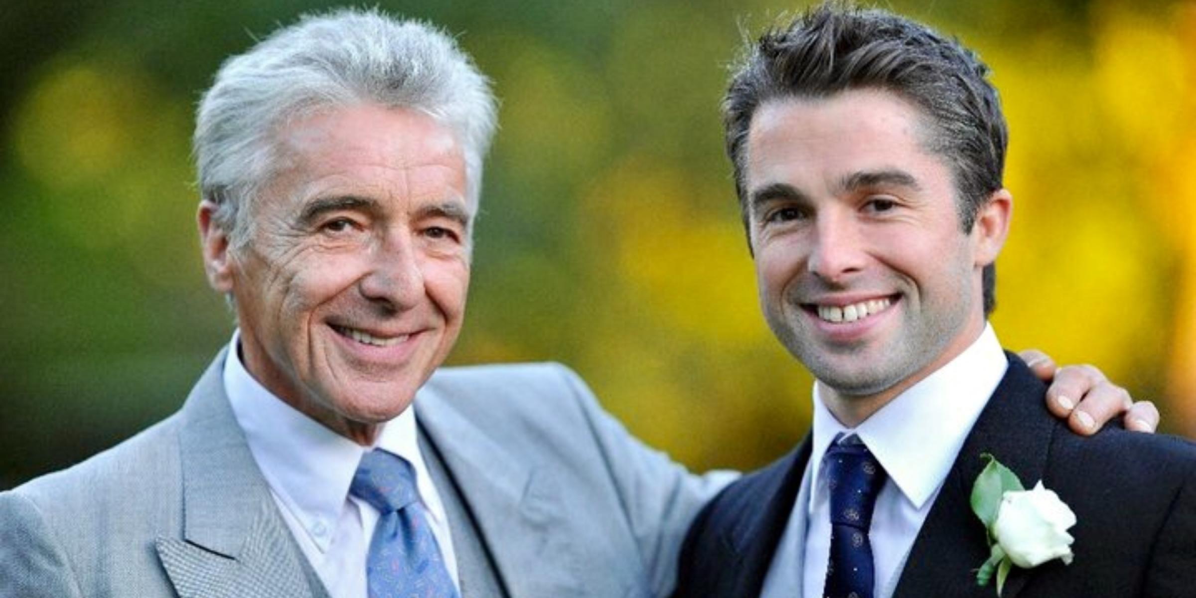 Charlie Starmer-Smith with his dad, both wearing suits at a wedding, and smiling