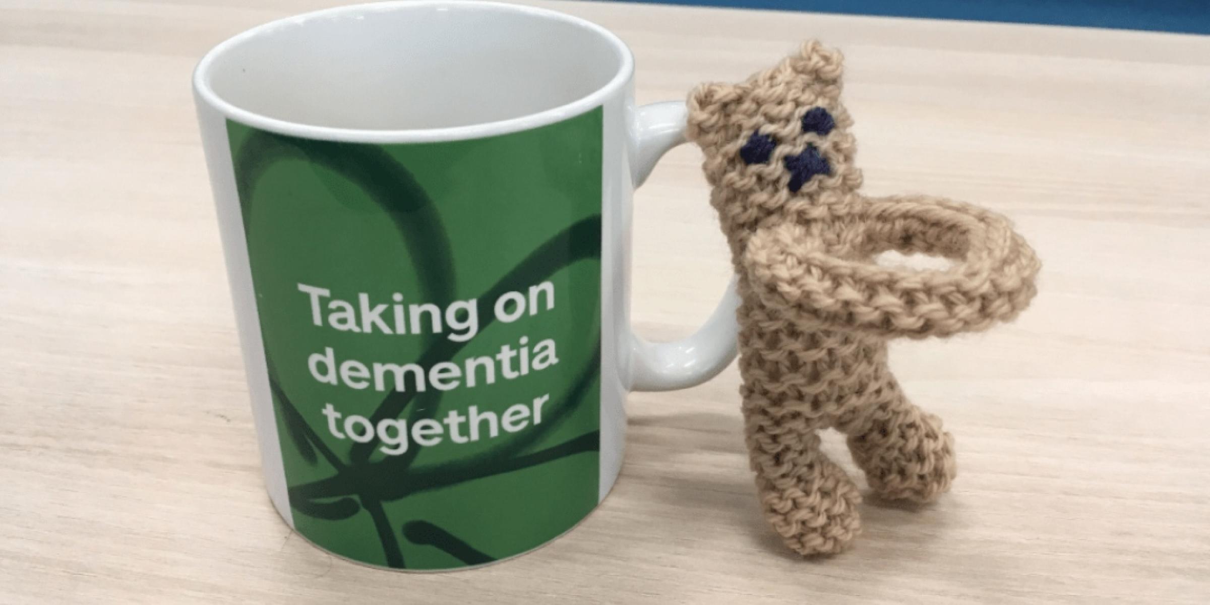 A fidget toy pictured next to an Alzheimer's Society branded mug