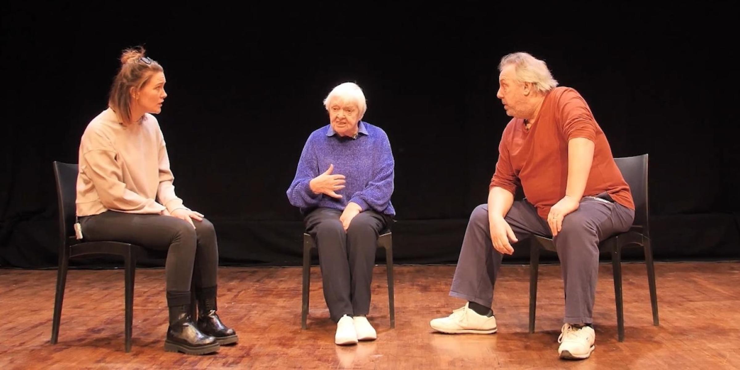 3 people onstage in a play