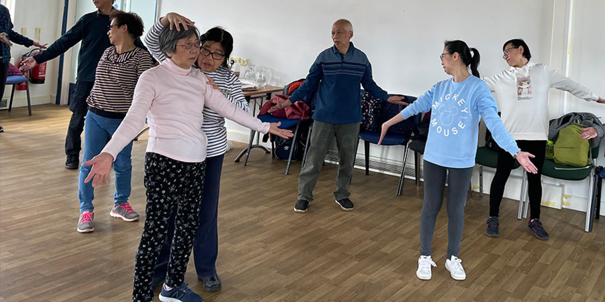 A group takes part in Qigong