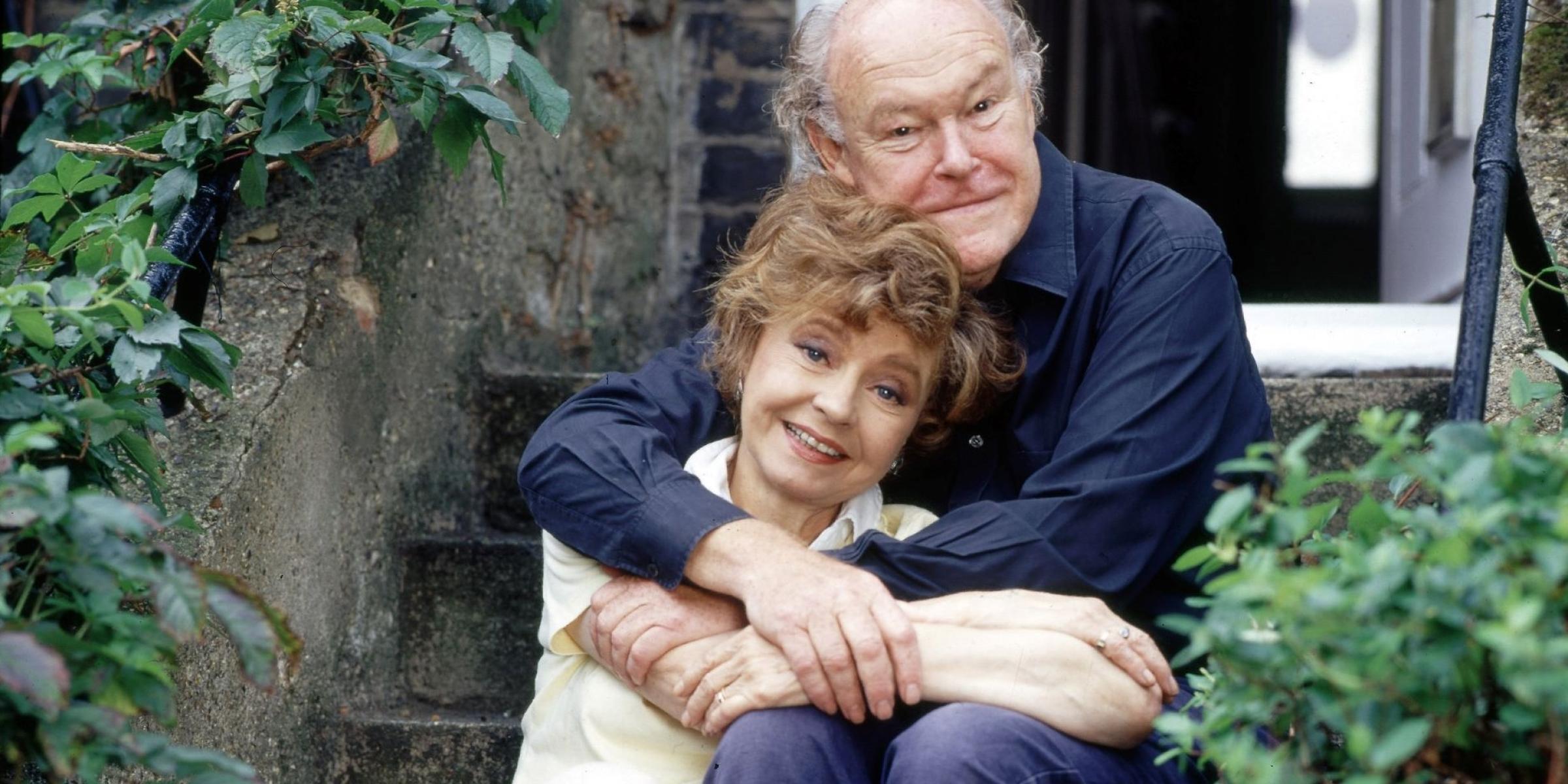 Timothy West and wife Pru hugging outside