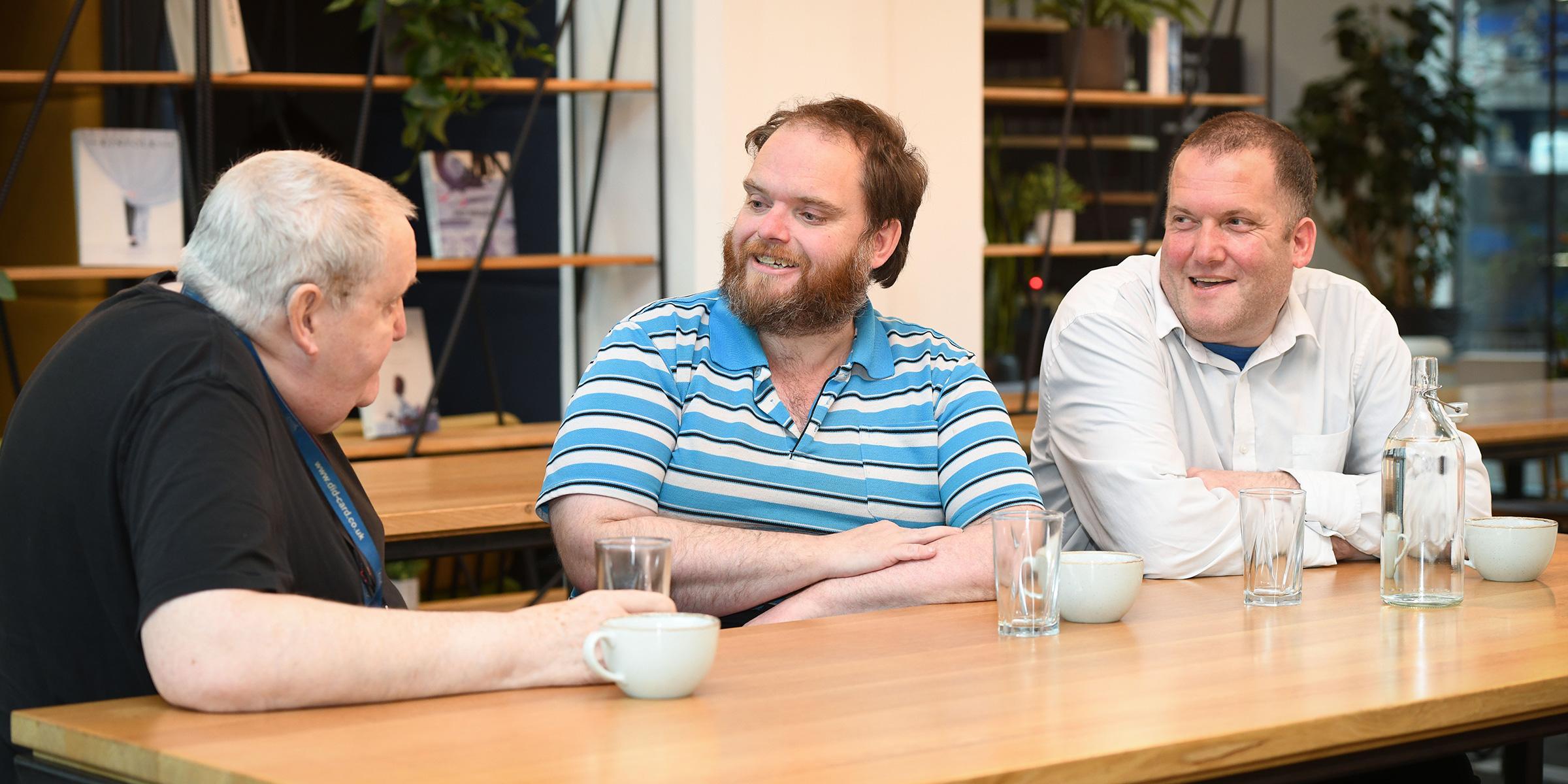 Left to right: Bob Joesbury, Adam Joesbury and Neil Joesbury sit and have a coffee together