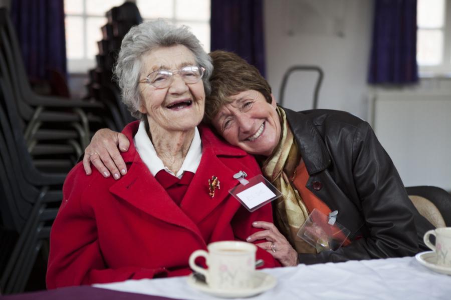 A woman with dementia and their carer