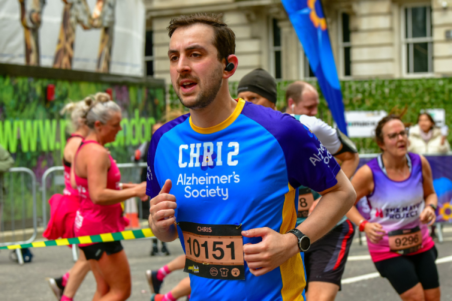 Alzheimer's Society runner surrounded by other runners