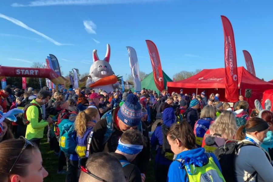 a crowd at athe start line with a giant bunny in the backgroun