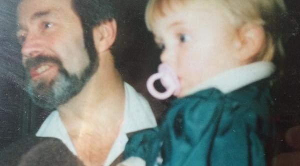 Lucy as a baby with her father