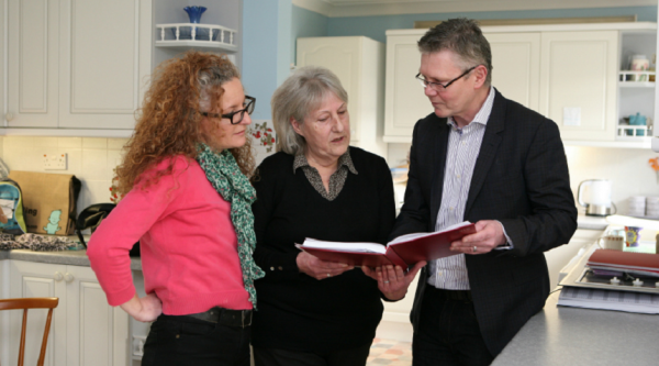 people in a kitchen talking