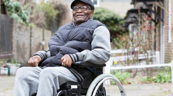 Man in a wheelchair smiling