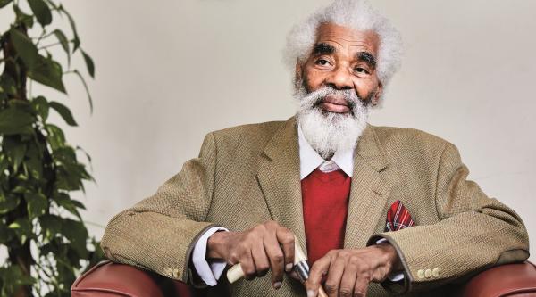 Charles sitting in an armchair