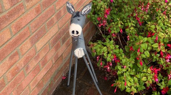 A wooden donkey, made from logs, by Carl Grint