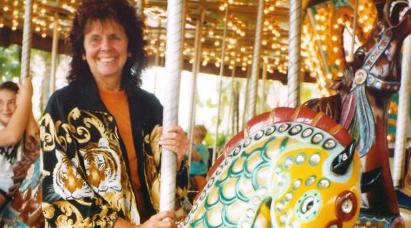 Julie riding a carousel