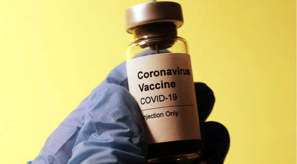 Stock image of COVID-19 vaccine bottle - Photo by Hakan Nuval on Unsplash