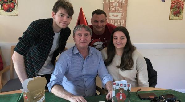 Jess with her brothers and their dad at Christmas 2019