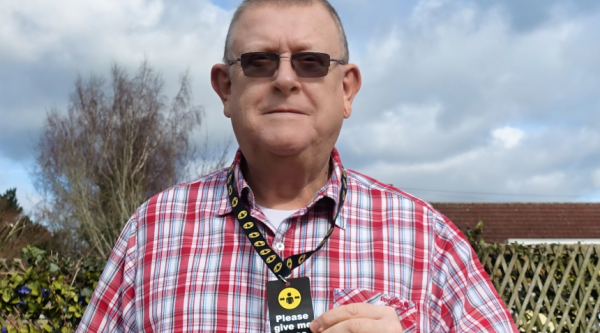 Peter Middleton wearing a Please give me space lanyard