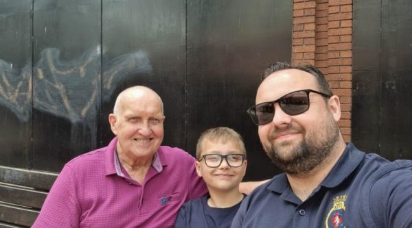 Keith Day sat with his family