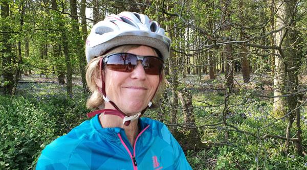Research Network Volunteer Rosemary Phillips on a bike ride in the woods